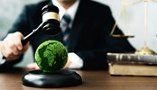 Judge hold wooden gavel with golden scale and globe for law international environmental concepts of business corporate and industry. law world environmental regulation.sustainable environment concept