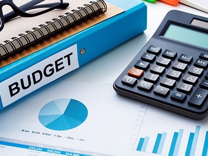 Budget, calculator, paper