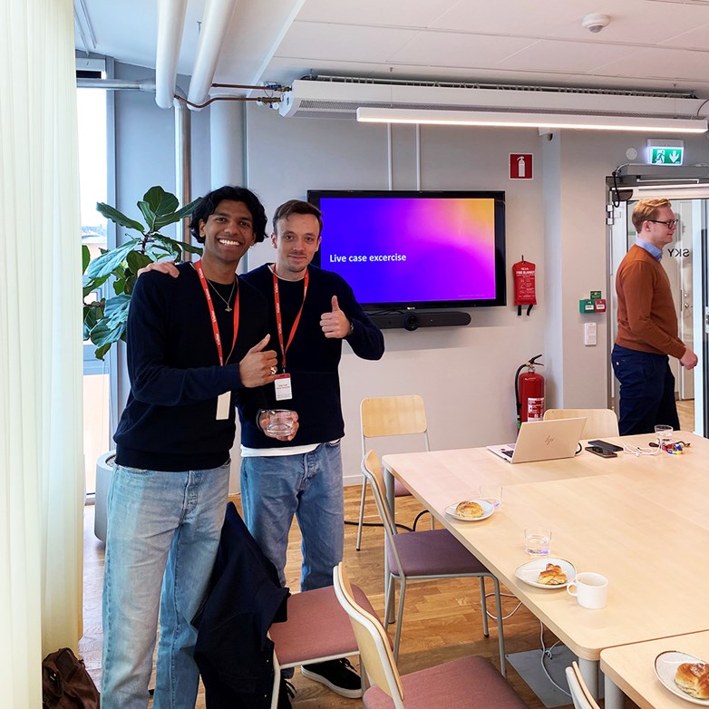 Students smiling and giving a thumbs up at a Accenture workshop