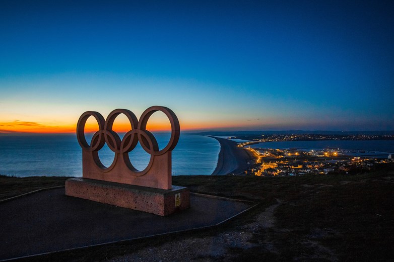 olympic ringa with a sea background