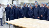 Johan Rosenblom, Managing Director & VP Fazer Retail together with students in the Gateu factory.