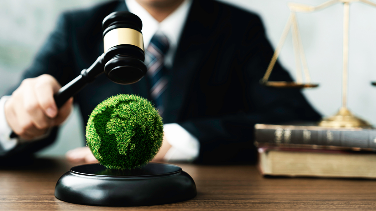 Judge hold wooden gavel with golden scale and globe for law international environmental concepts of business corporate and industry. law world environmental regulation.sustainable environment concept