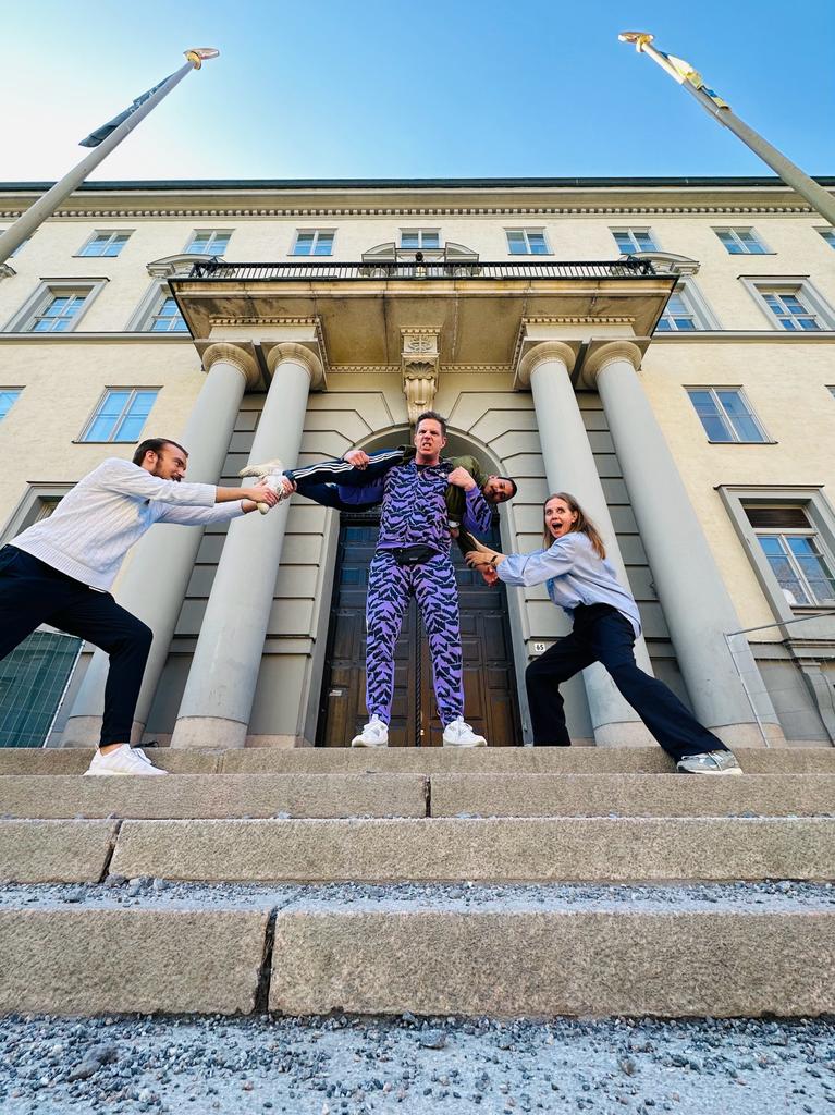 people in front of the oak door