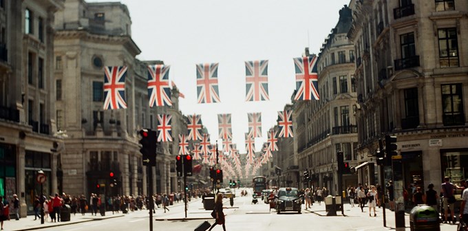 City-scape London with Union Jack flag hanging in street