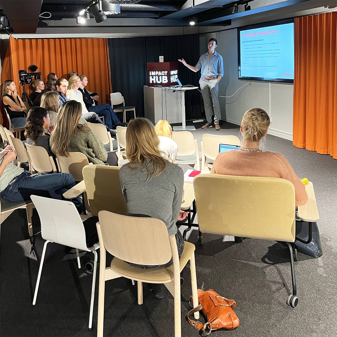 Retail Management students in the Circular Impact Retail Club listening to a representative from Relovie presenting.