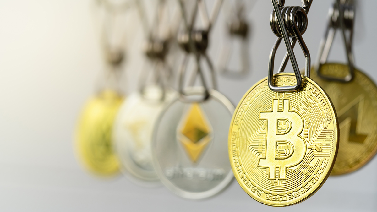 Money Laundering. Bitcoin coins hanging on clotheslines. Money Laundering Bitcoin coins hung out to dry. Photo: Shutterstock