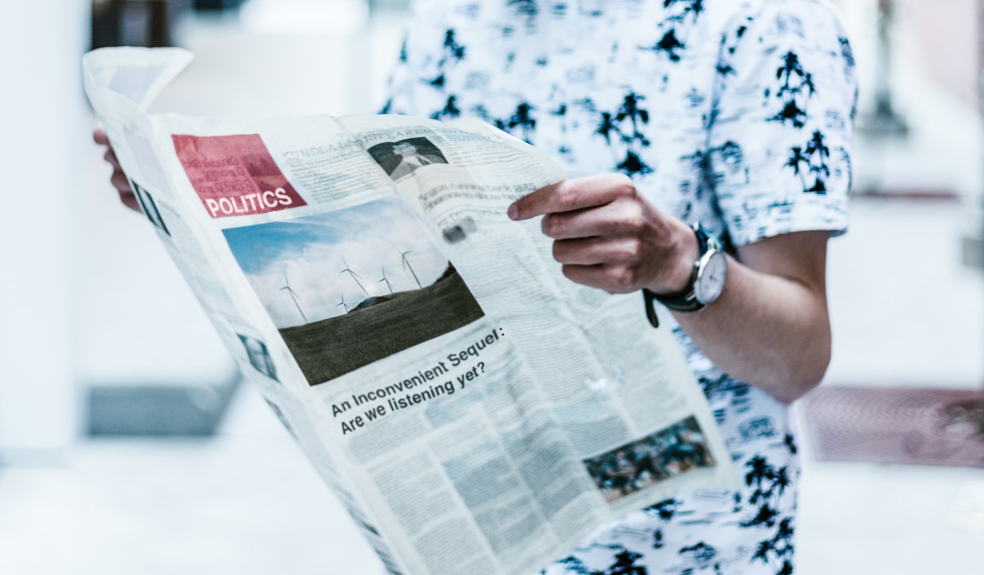 man reading news paper