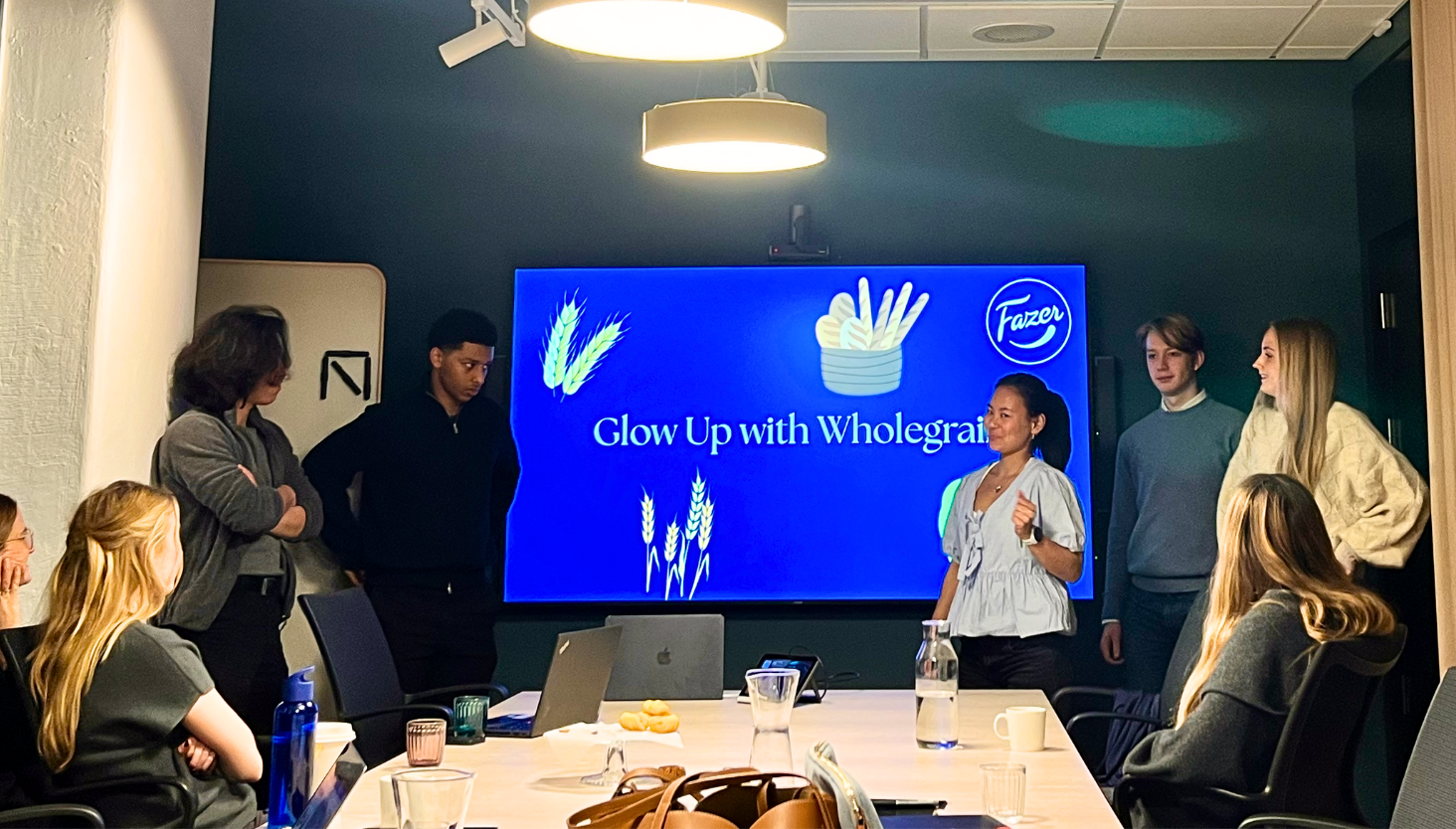 Students presenting at a workshop with Fazer