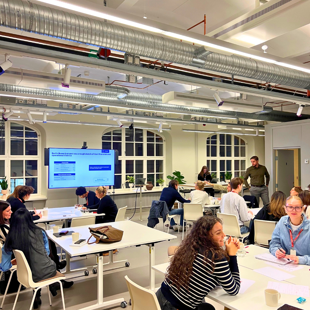 Workshop in the making at Accenture HQ. Open office landscape and students are on to their task.