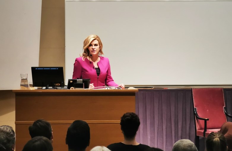 Kolinda on the podium in an aula talking to an audience