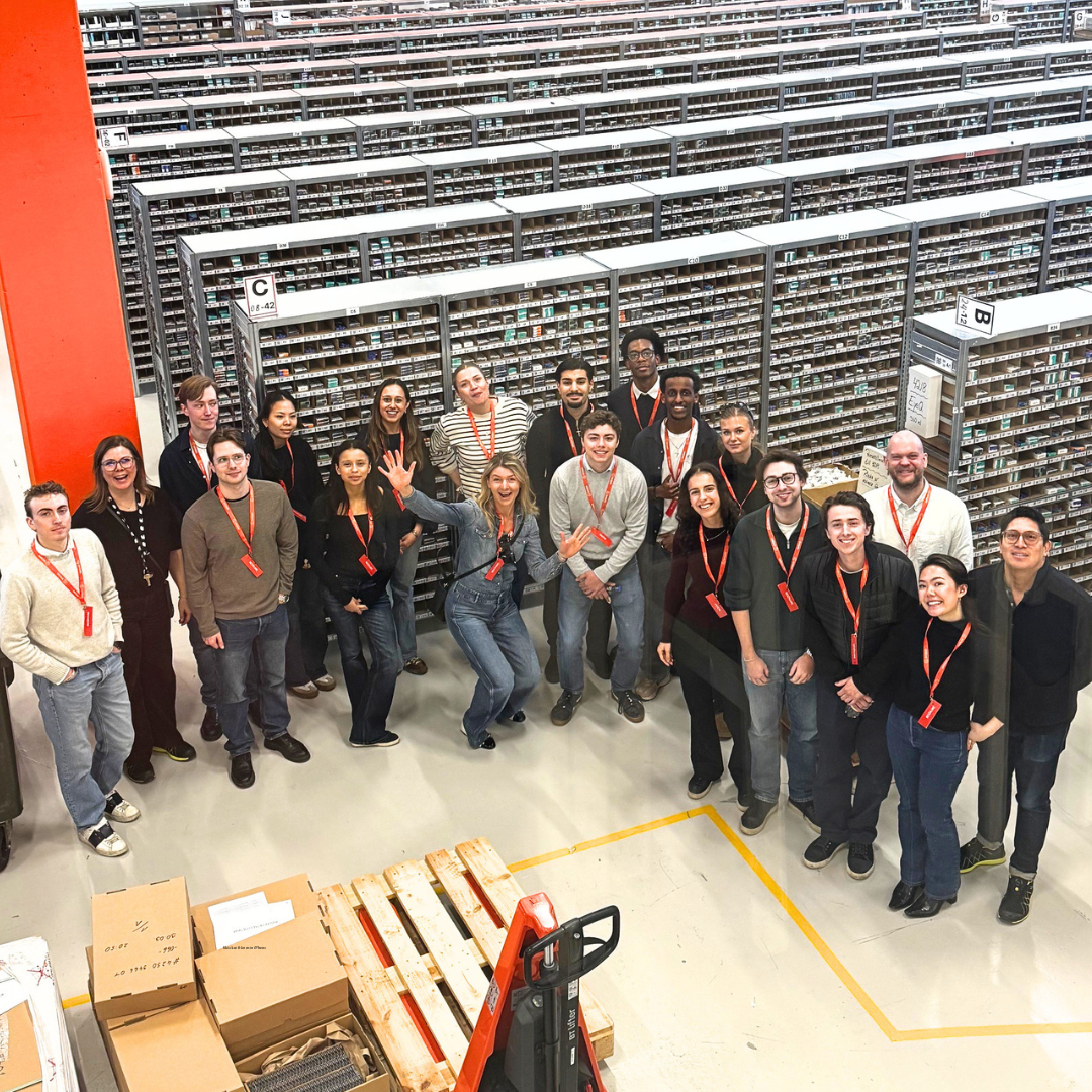 Picture of students and company reps at Synsam's warehourse in Spånga.