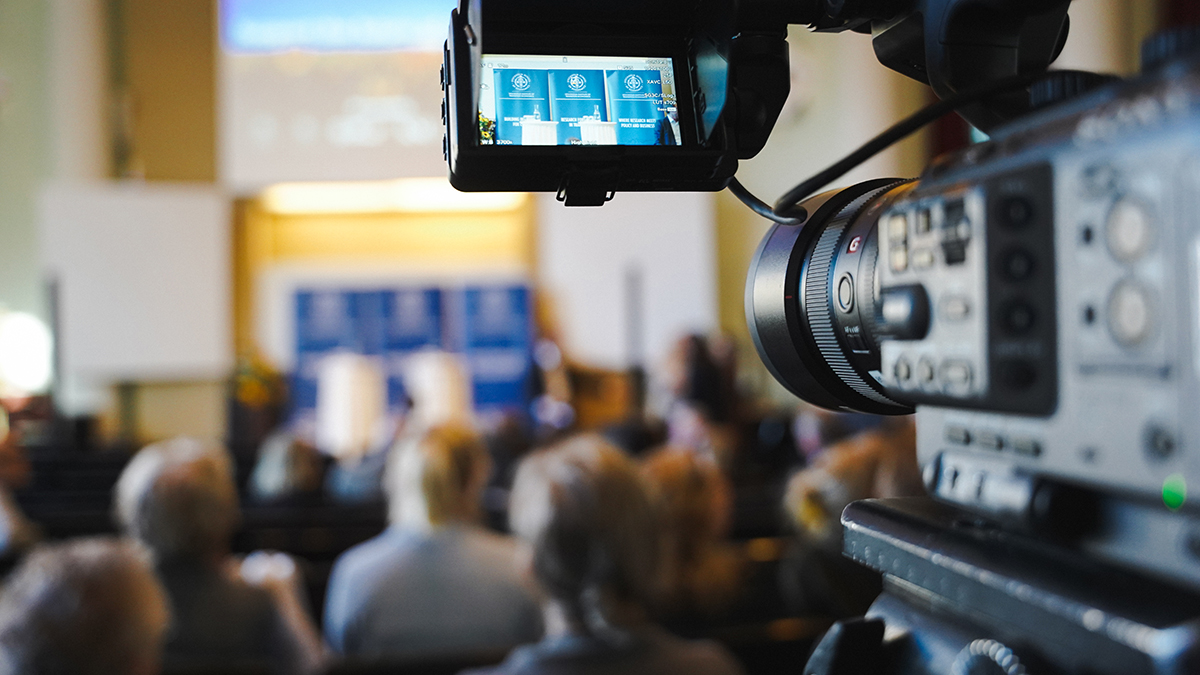 Photo of blurry picture with a video camera at the side