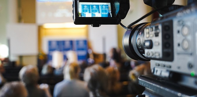 Photo of blurry picture with a video camera at the side