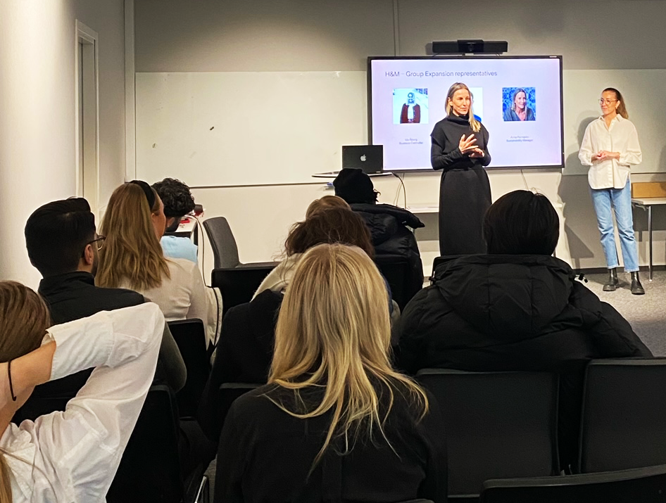 Anna Palmqvist, Sustainability Manager for H&M Group Global Expansion, and collegues holding a presentation in front of a group of students.