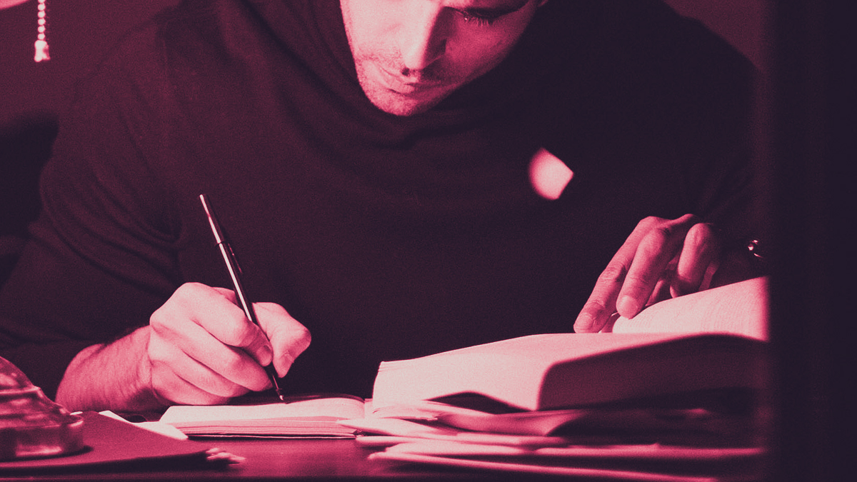 Man writing a book in his office
