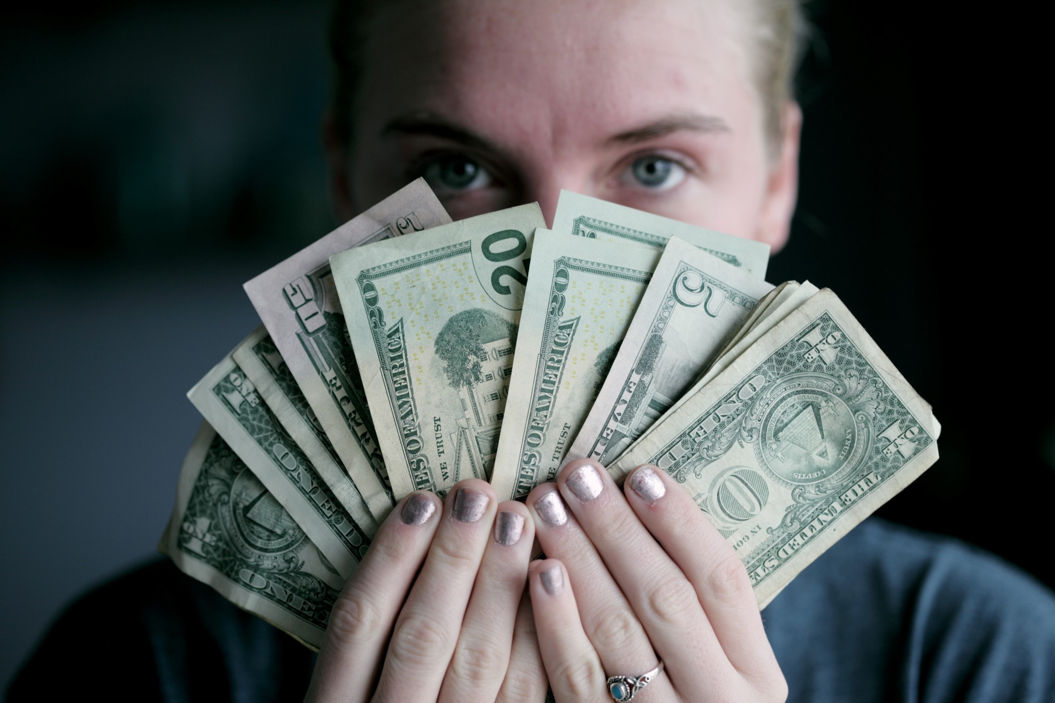 Young woman holding money