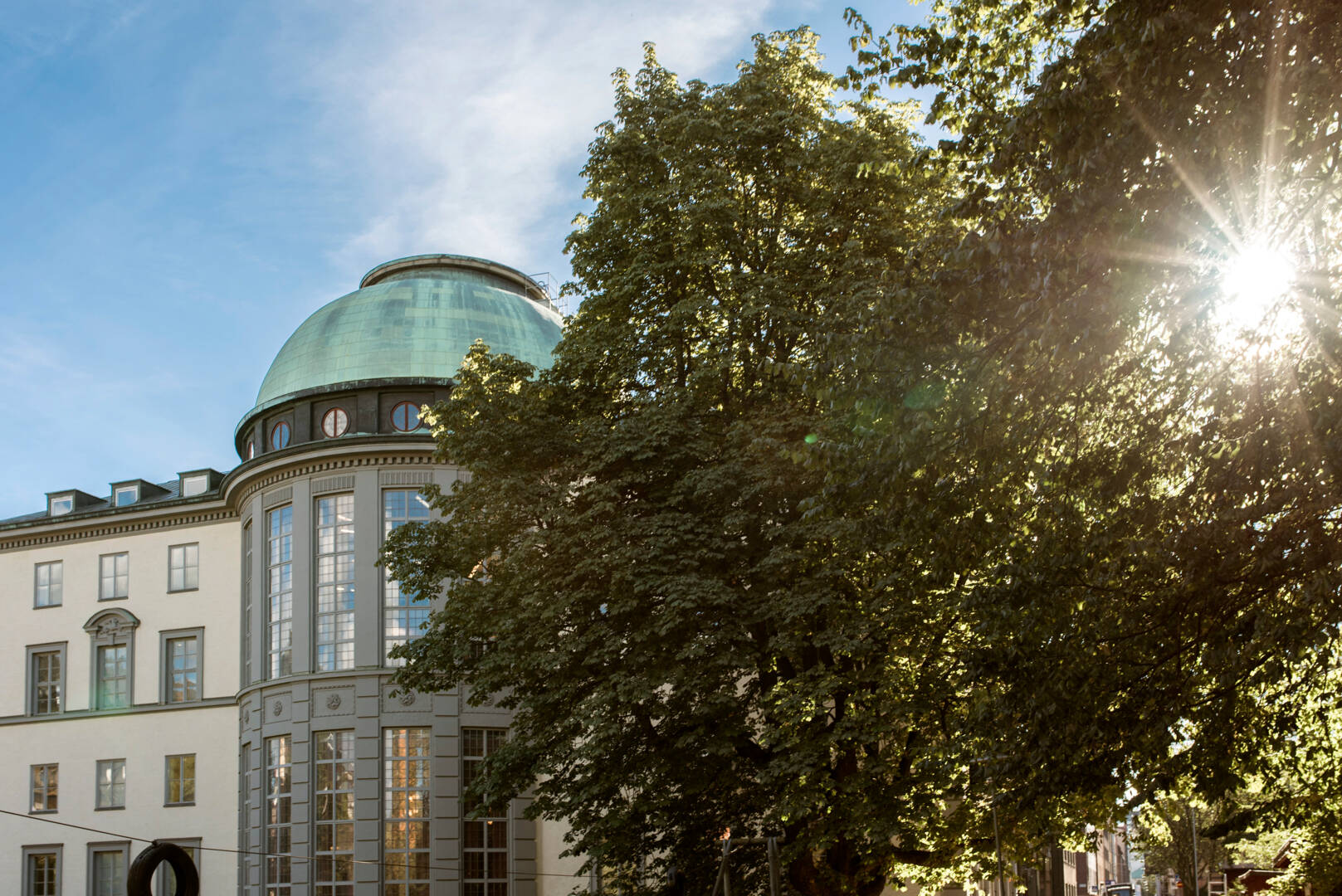 SSE in summer light with trees in the front.