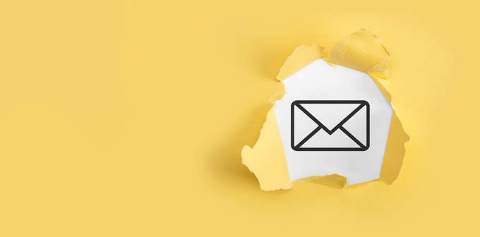 orn yellow paper with letter email icon on white background.
