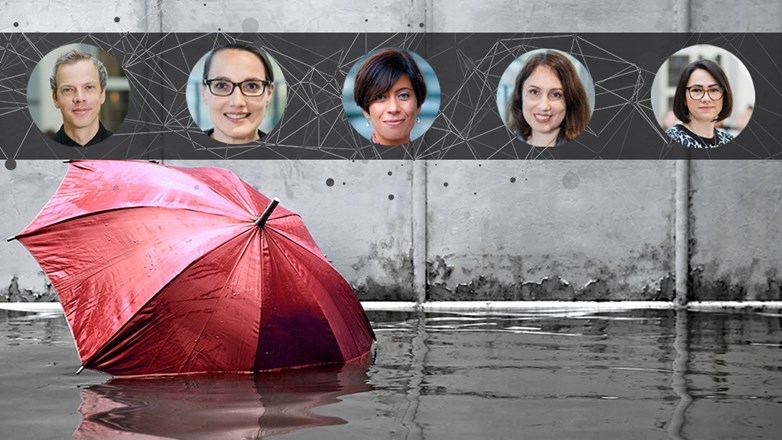 red umbrella floating on flooded street