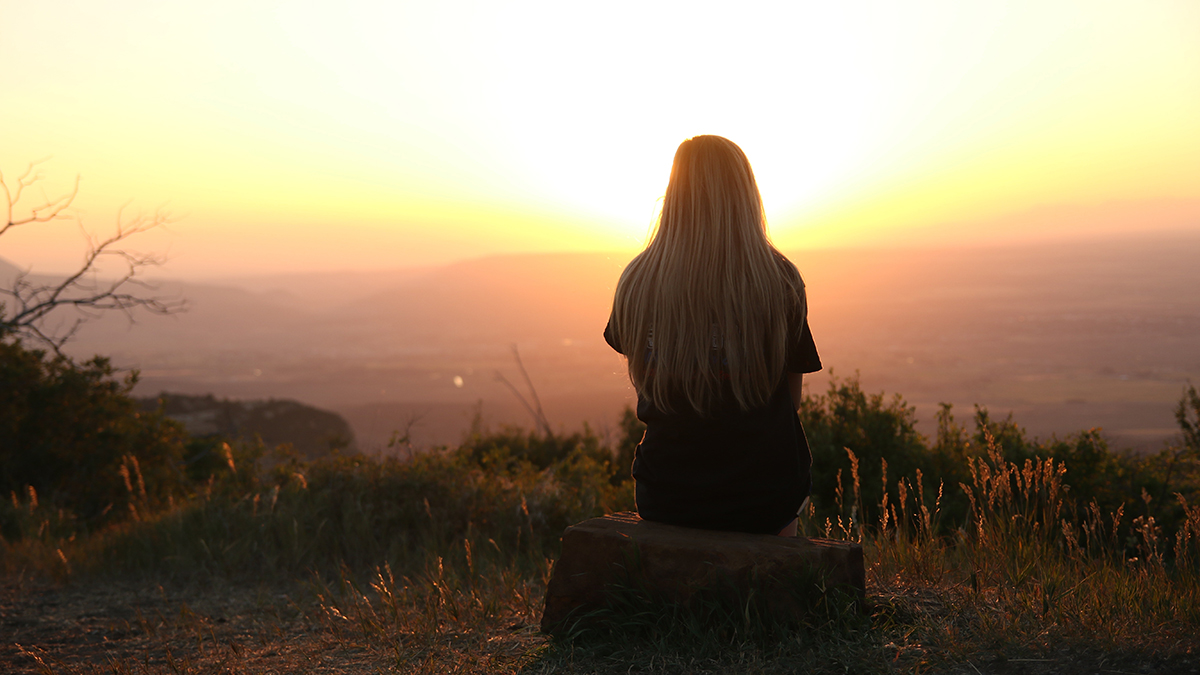 Girl looking at the sunset