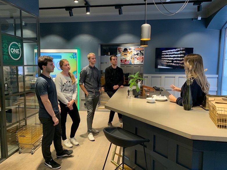 Students listening to a representative at a Swedish Match store