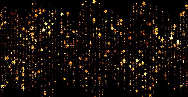 Falling rain of golden glittering stars confetti style on black bakground.