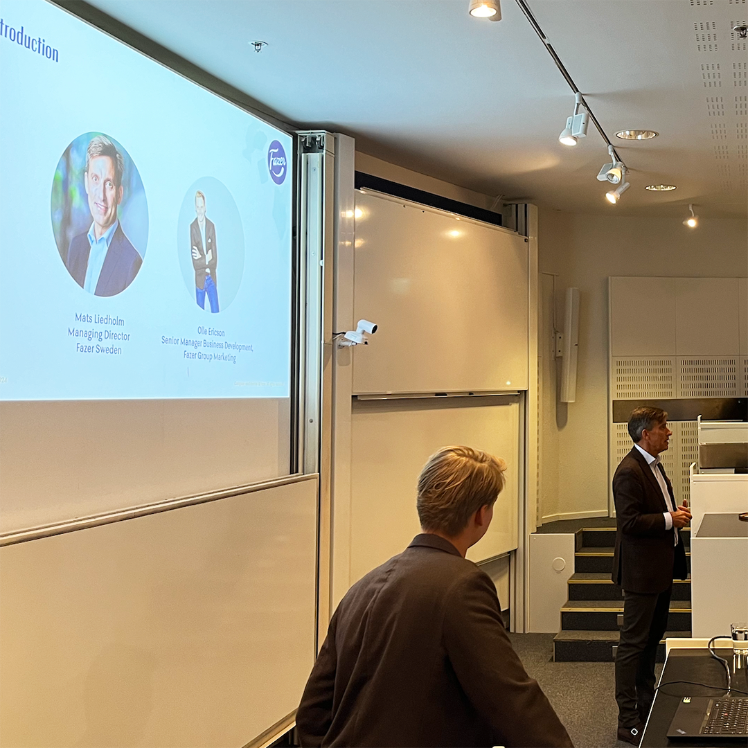 Mats Liedholm (CEO) and Olle Ericsson (Senior Manager Business Development) presenting in front of students.