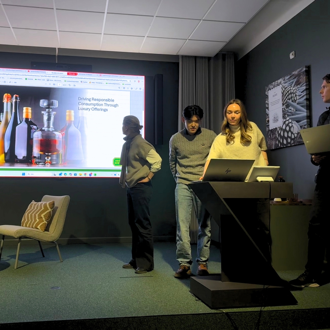 Students presenting at a workshop at Systembolaget HQ