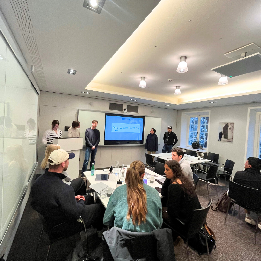 Students having a workshop in a conference room at Novax HQ.