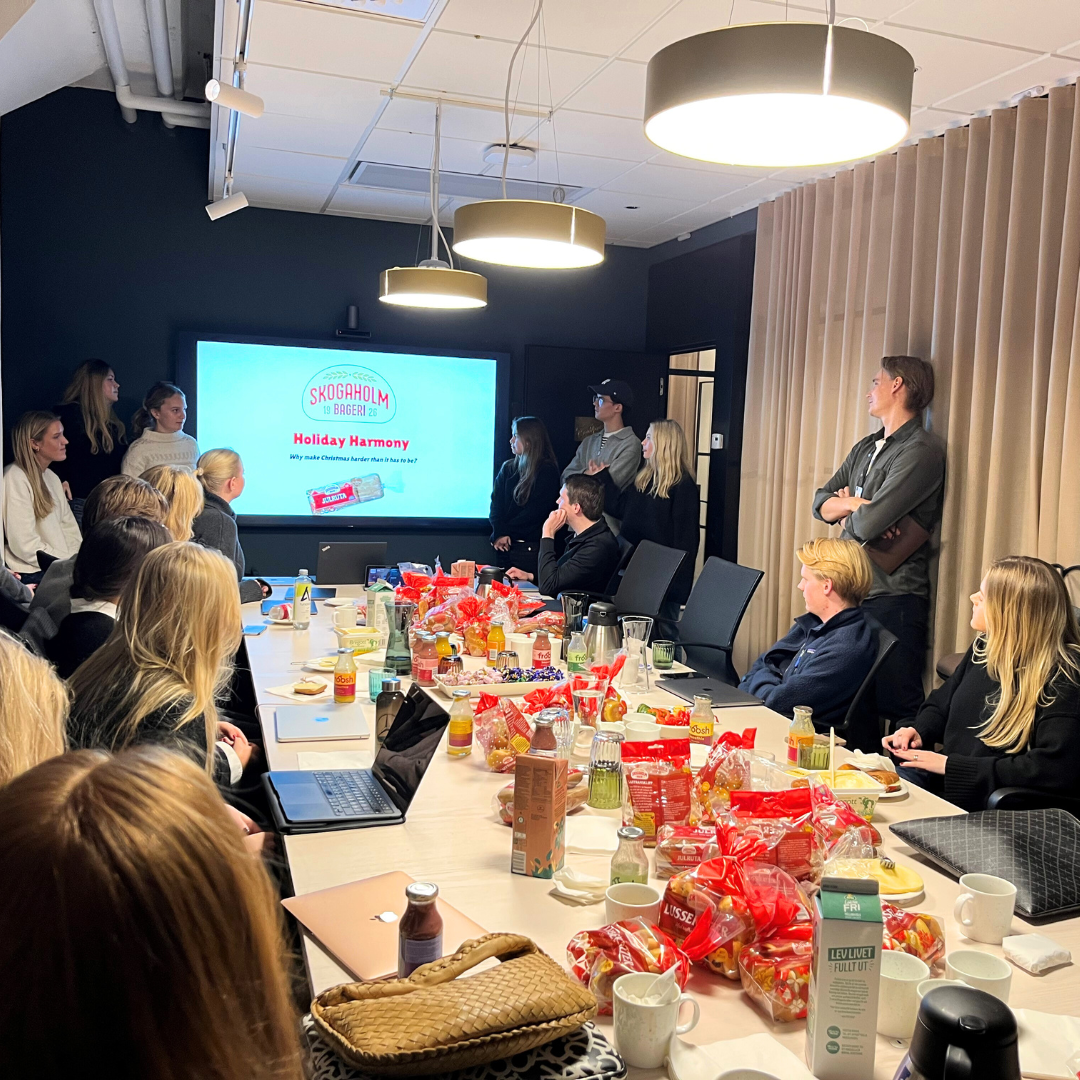Students at Fazer HQ presenting in a cosy conference room.
