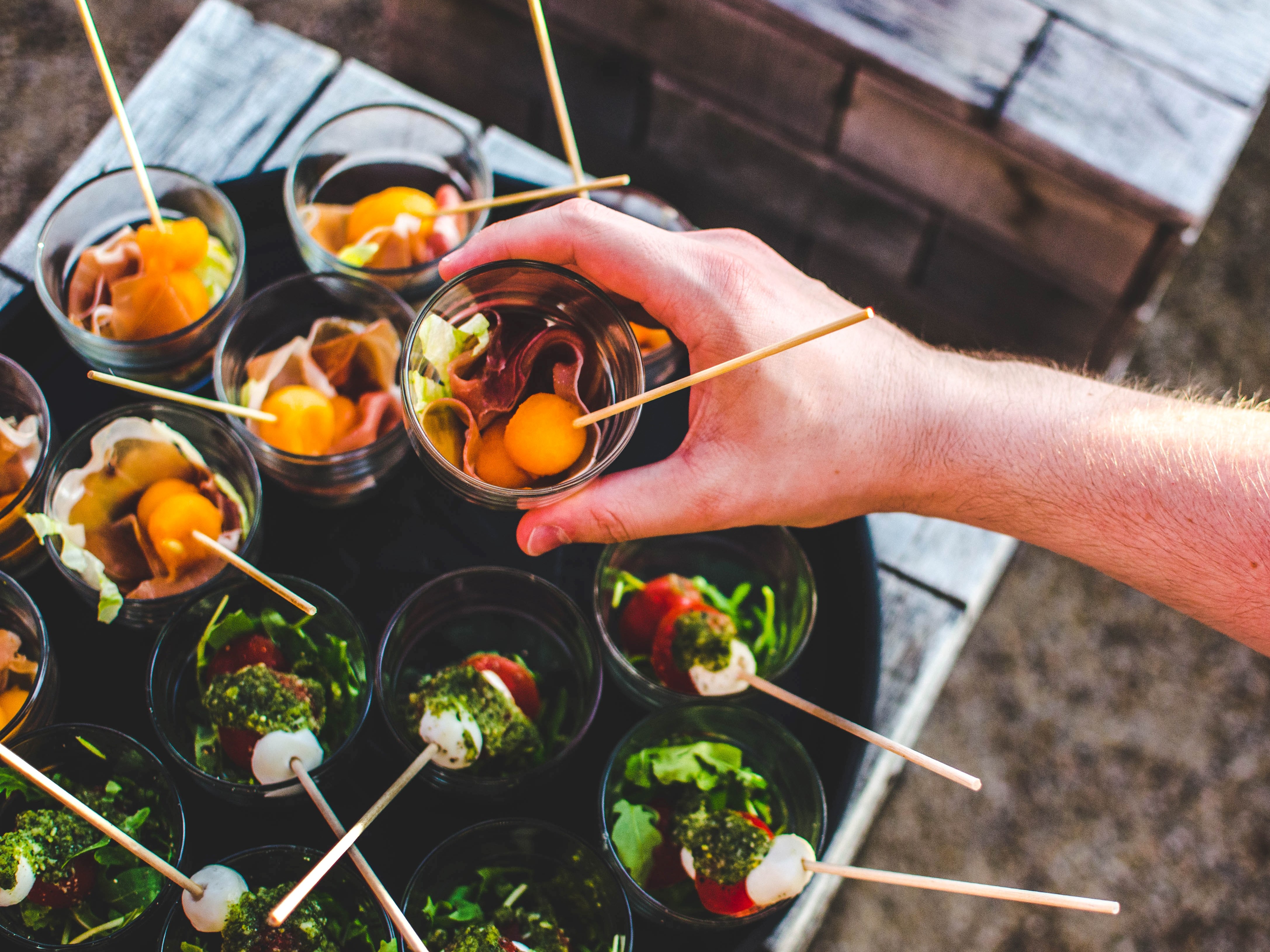 Nice food and hand grabbing it.