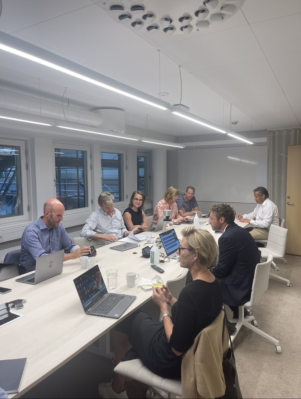 Board members sitting around a table and talking