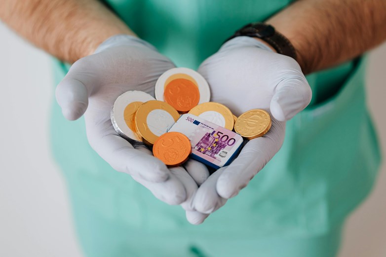 Doctor with money in their hands