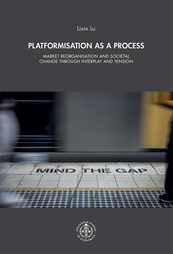 Book cover photo: A blurred train passes a subway platform where the words “MIND THE GAP” are painted along the edge, while indistinct figures stand nearby.