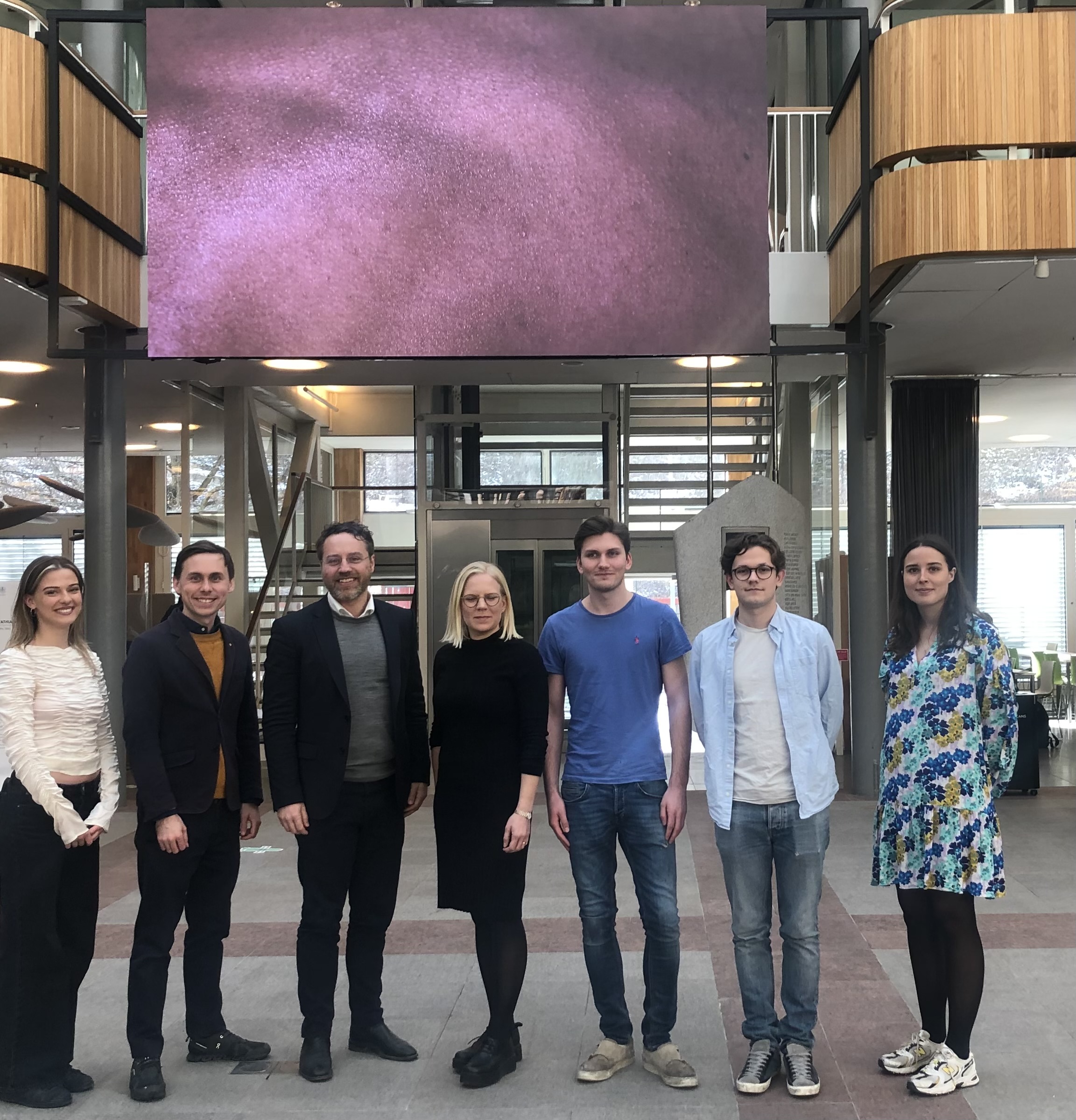 People standing in a school atrium