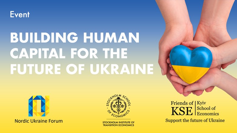An adult, mother, father and child hold a Ukraine heart in their hands.