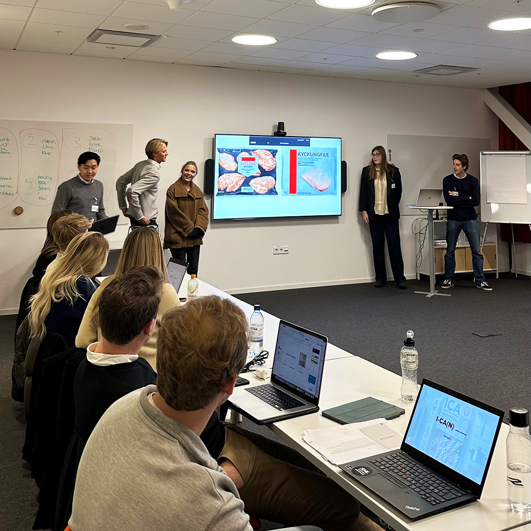 Group of students presenting in a conference room at ICA HQ, Solna