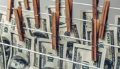 Money Laundering concept. US dollars hung out to dry and clean