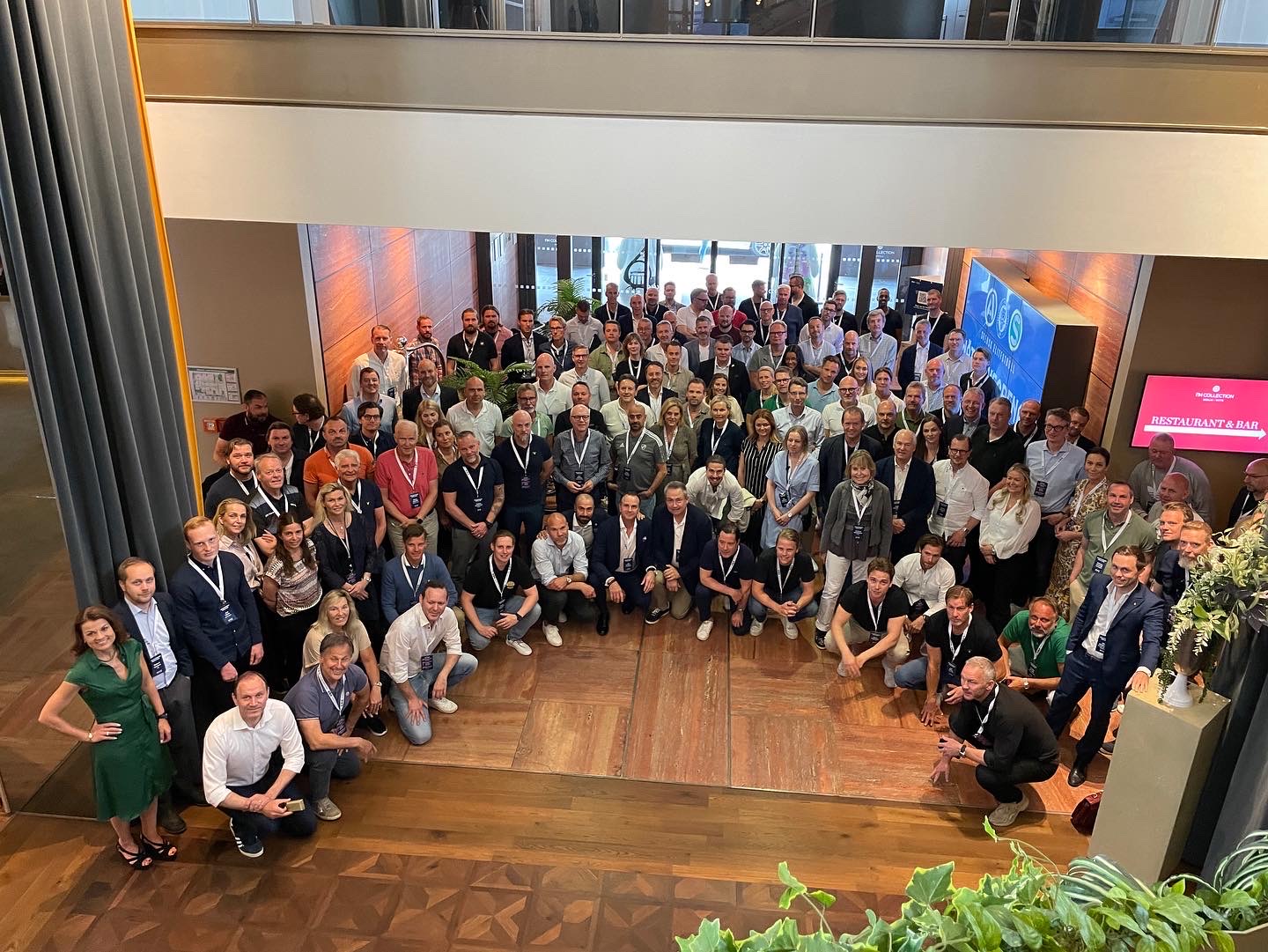 Participants in a half circle watching into the camera