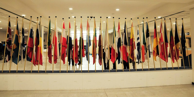 Photo of room with multiple flags