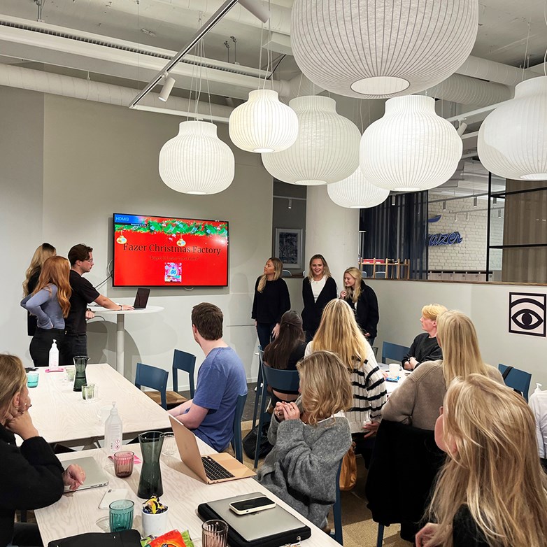 Students presenting an assignment at Fazer HQ, Stockholm.