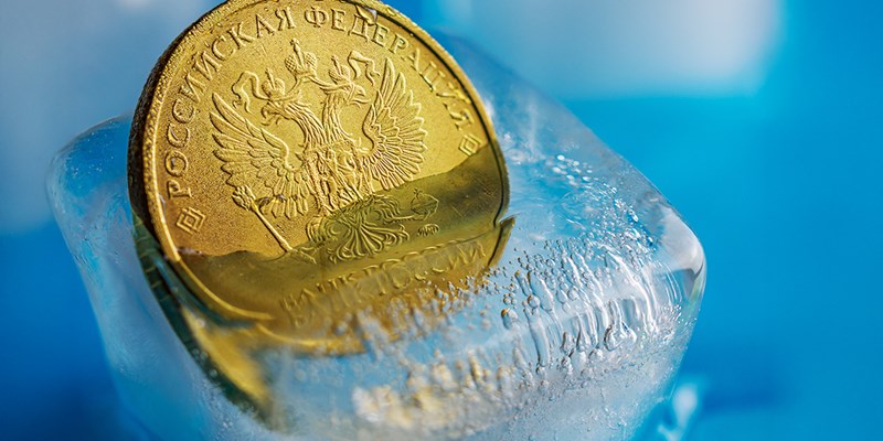 Ten Russian ruble coin in a piece of ice