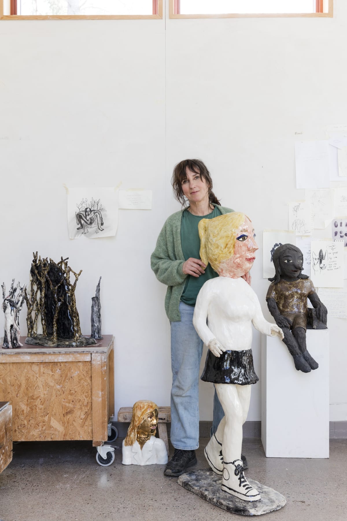 The artist Klara Kristalova surrounded by her sculptures at Galleri Magnus Karsson