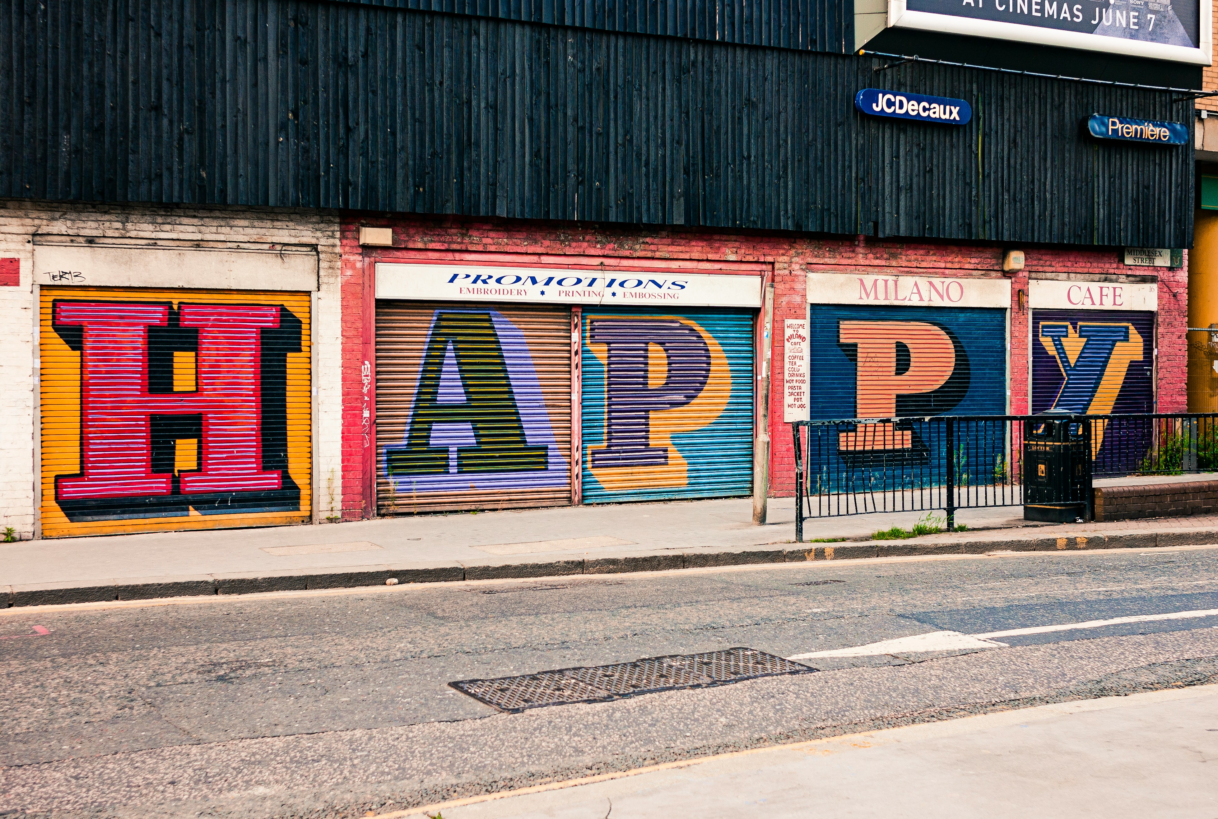 "Happy" written on a wall