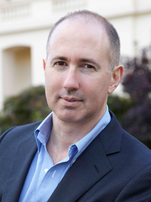 Press picture of Prof. Bruce Hardie, London Business Scholl smiling into the camera wearing a blue shirt and a navy jacket.