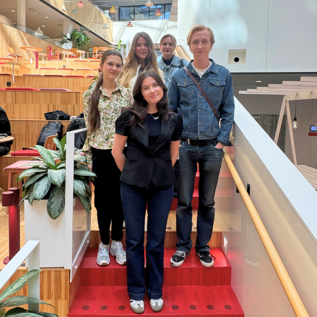 Students standing on stairs at ICA's head office