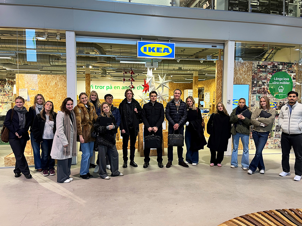 Students stand in line for a photo outside IKEA Second Hand in ReTuna mall, Eskilstuna.