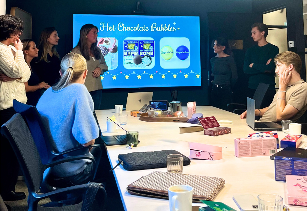 Students presenting at a workshop with Fazer