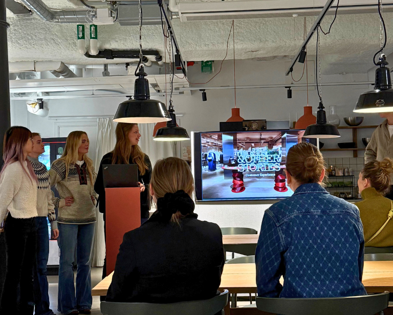 Students presenting in a workshop at H&M