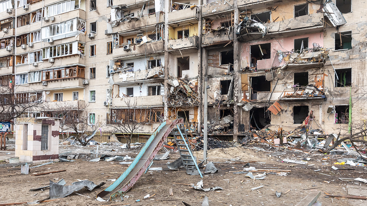 KYIV, UKRAINE - Feb. 25, 2022: War of Russia against Ukraine. A residential building damaged by an enemy aircraft in the Ukrainian capital Kyiv